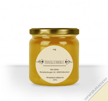 Rundes Etikett "Klassik Times" auf cremefarbigem Leinenstrukturpapier