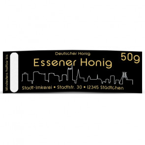 Matter Golddruck auf gold-schwarzem Honigetikett "Essen"