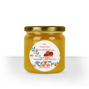 Rundes Etikett "Bienentraum" auf Honigglas